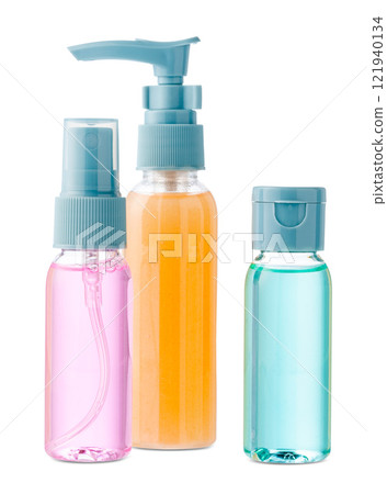Various bottles with colored liquids and pumps arranged on white background Various bottles with colored liquids and pumps arranged on white background 121940134
