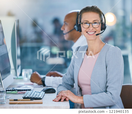 Woman call center agent working in office, employee looking confident and helping people online on computer at work. Portrait of happy customer service worker giving support at startup company 121940135