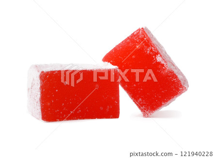 Bright red gummy candy pieces on a white background showcasing their sugary texture and bold color Bright red gummy candy pieces on a white background showcasing their sugary texture and bold color 121940228