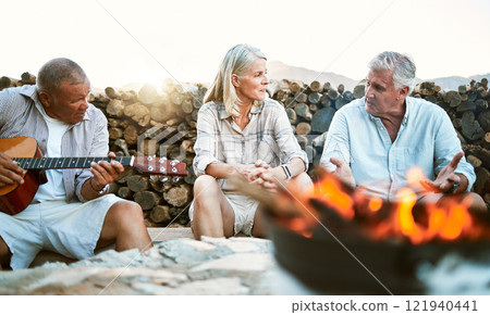 Senior, adventure and fun wellness hiking group of friends, relaxing or taking a break by the campfire after walking on outdoors mountain trip. Elderly explorers resting on camping getaway trip Senior, adventure and fun wellness hiking group of friends, relaxing or taking a break by the campfire after walking on outdoors mountain trip. Elderly explorers resting on camping getaway trip 121940441