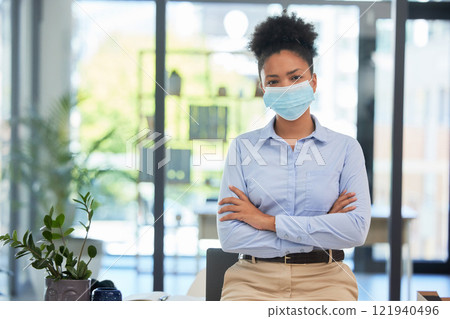Covid mask policy and safety in the office workplace with businesswoman covering her face during quarantine, lockdown or flu season. Respectful and leadership professional female in a work portrait 121940496