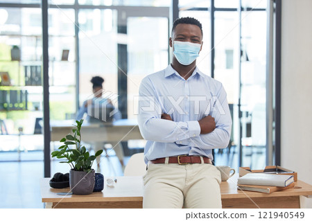 Covid, mask policy and safety in the office workplace with businessman covering his face during quarantine, lockdown or flu season. Leader, manager and professional young man at work in a pandemic. 121940549