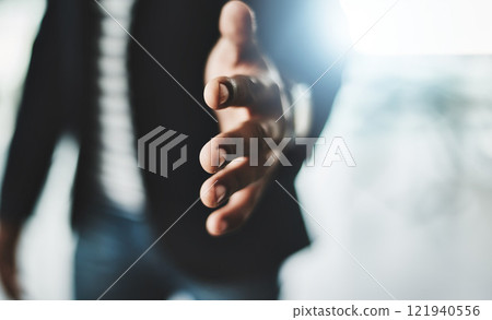 Handshake, welcome and greeting with a business man reaching out his hand to congratulate, promote or celebrate success. Closeup of teamwork, unity and togetherness with a corporate professional 121940556