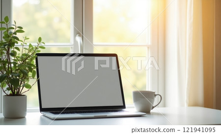 Modern Tidy Desk Setup with Laptop and Coffee 121941095