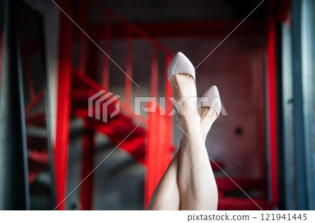 Woman feet high heels shoes in hotel, closeup 121941445