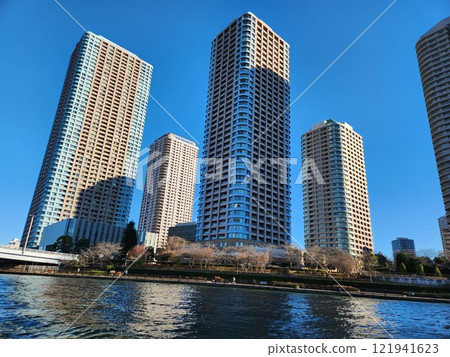 Tsukudajima's skyscraper apartment complexes as seen from the Sumida River water bus 121941623
