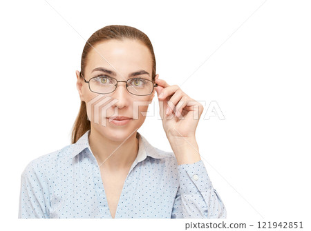 Confident caucasian young female wearing glasses and blue shirt looking Confident caucasian young female wearing glasses and blue shirt looking 121942851