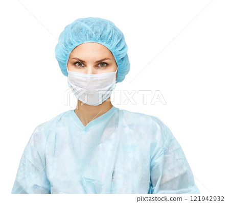 Female caucasian medical professional in surgical attire with mask and cap 121942932