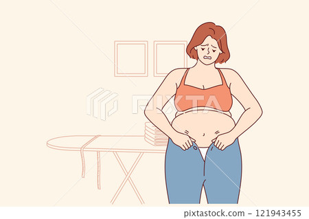 Woman experiencing problems with excess weight tries to put on small pants, and needs diet or fitnes 121943455