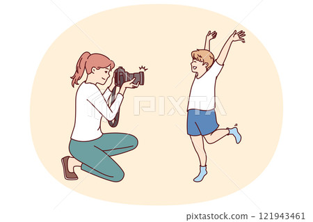 Photographer mother and little boy make photoshoot to capture happy moments from childhood 121943461