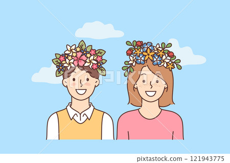 Happy children with flowers decorating heads rejoice at onset of warm days and spring season 121943775