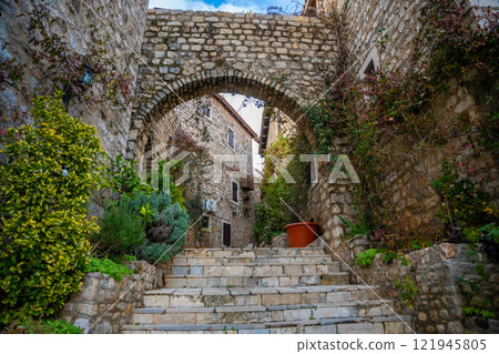 Narrow street in Ulcinj Old Town in Montenegro, the southernmost city at Montenegrin coast, Europe Narrow street in Ulcinj Old Town in Montenegro, the southernmost city at Montenegrin coast, Europe 121945805