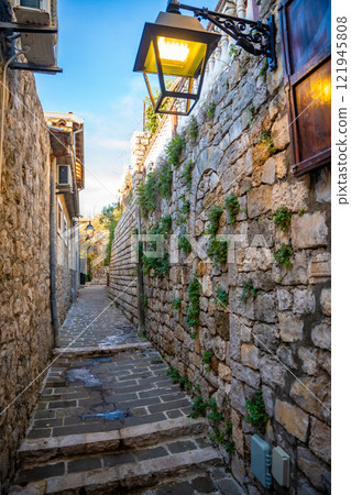 Narrow street in Ulcinj Old Town in Montenegro, the southernmost city at Montenegrin coast, Europe Narrow street in Ulcinj Old Town in Montenegro, the southernmost city at Montenegrin coast, Europe 121945808
