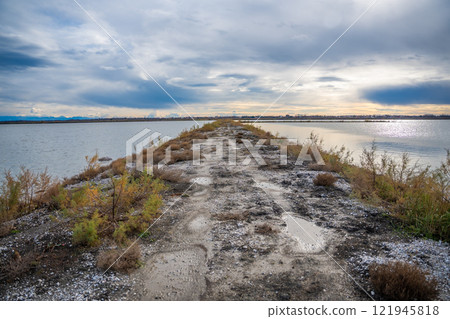 Landscape view of Salina nature park with flamingos near Ulcinj town in winter time in Montenegro 121945818
