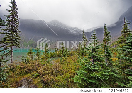 Hiking view near Mt Garibaldi with turquoise lake and dramatic clouds in the mountains 121946262