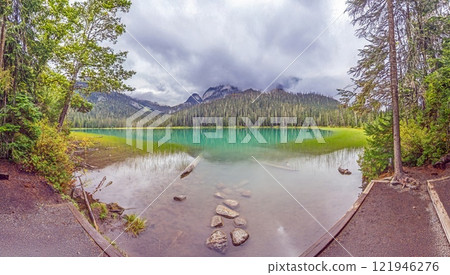 Hiking view near Mt Garibaldi with turquoise lake and dramatic clouds in the mountains Hiking view near Mt Garibaldi with turquoise lake and dramatic clouds in the mountains 121946276