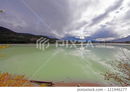Hiking view near Mt Garibaldi with turquoise lake and dramatic clouds in the mountains 121946277