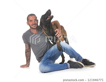 malinois and owner in studio 121946771