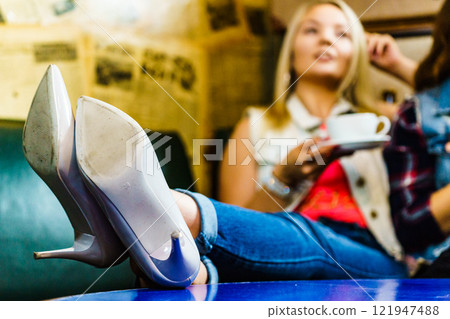 Woman relaxing drinking tea or coffee Woman relaxing drinking tea or coffee 121947488