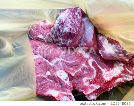 fresh raw beef meat in a plastic shopping bag 121948085