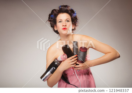 funny girl styling hair holds many accessories 121948337