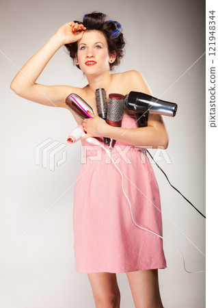 funny girl styling hair holds many accessories 121948344