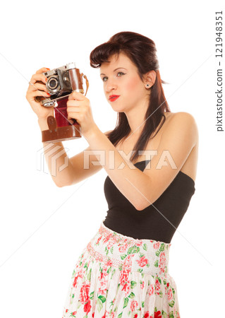 Lovely teen girl with old camera 121948351