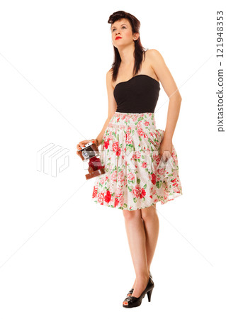 Teen girl with old camera 121948353