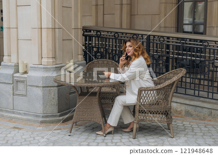 Woman Business Phone Call Cafe Table White Suit Outdoor 121948648