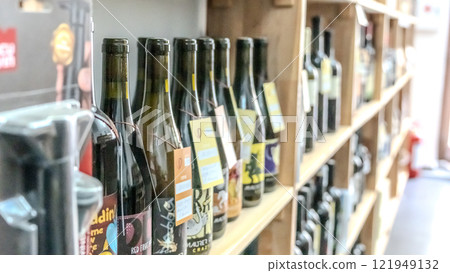 Bottles of wine on a shelf in a store 121949132