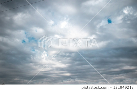 Overcast sky with dark clouds. Dark sky before a thunder-storm. The gray cloud background before rain. Overcast sky with dark clouds. Dark sky before a thunder-storm. The gray cloud background before rain. 121949212