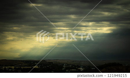 Overcast sky with dark clouds. Dark sky before a thunder-storm. The gray cloud background before rain. 121949215