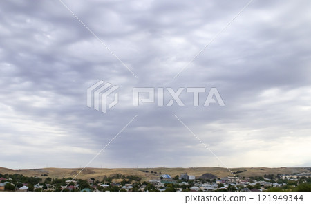 Overcast sky with dark clouds. Dark sky before a thunder-storm. The gray cloud background before rain. Overcast sky with dark clouds. Dark sky before a thunder-storm. The gray cloud background before rain. 121949344