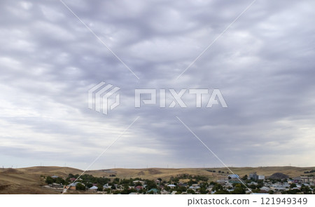 Overcast sky with dark clouds. Dark sky before a thunder-storm. The gray cloud background before rain. 121949349