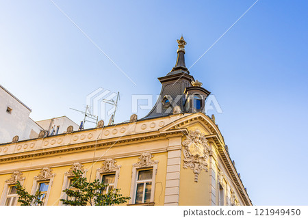 Elegant corner building with classical architecture against a clear blue sky in Belgrade, Serbia. Perfect for urban design, travel, and historical content. High quality photo Elegant corner building with classical architecture against a clear blue sky in Belgrade, Serbia. Perfect for urban design, travel, and historical content. High quality photo 121949450