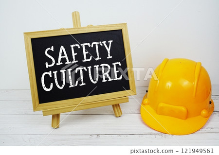 Safety Culture text on blackboard with safety helmet on wooden background Safety Culture text on blackboard with safety helmet on wooden background 121949561