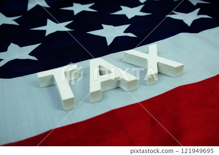 TAX alphabet letters with USA flag background TAX alphabet letters with USA flag background 121949695