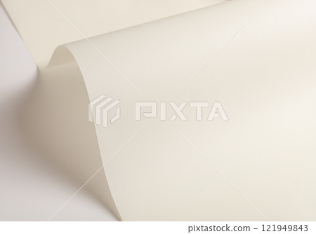 Ivory white paper background with a smooth, matte texture and gentle folds. Warm beige tones and a 121949843