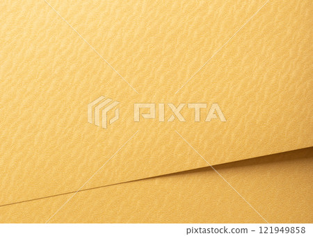 Golden yellow paper background with rippled, wavy textures and overlapping layers. Vibrant warm 121949858