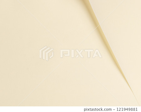 Cream beige paper background with a smooth, matte texture and subtle folds. Warm, muted tones and 121949881