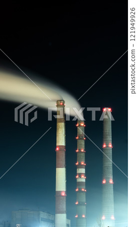 Night over the industrial city.Factory chimneys smoke.Environmental problem of environmental and atmospheric pollution.Climate change,environmental disaster.The sky is smoky with toxic substances Night over the industrial city.Factory chimneys smoke.Environmental problem of environmental and atmospheric pollution.Climate change,environmental disaster.The sky is smoky with toxic substances 121949926