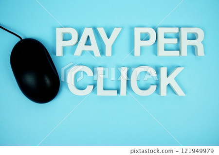Pay Per Click alphabet letters and optical mouse top view on blue background Pay Per Click alphabet letters and optical mouse top view on blue background 121949979