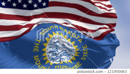 The South Dakota state flag waving along with the national flag of the United States of America The South Dakota state flag waving along with the national flag of the United States of America 121950063