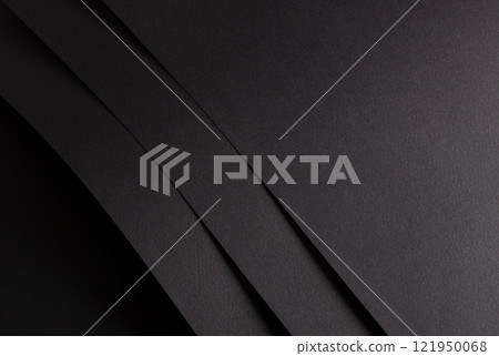 Charcoal black paper background with overlapping layers and a matte, grainy texture. Dark bold tones 121950068