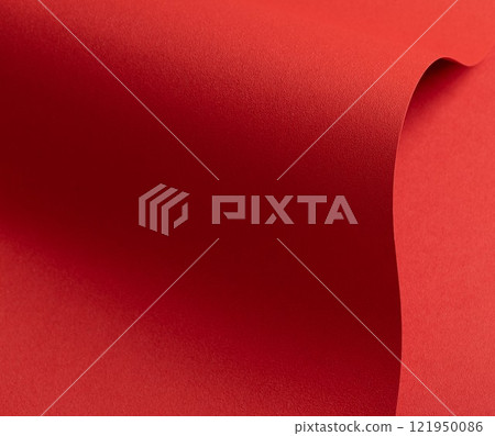 Red paper background with fiery tones and flowing curves. Vibrant and warm, featuring smooth 121950086