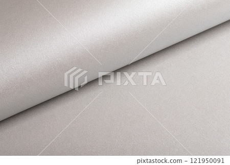 Platinum gray paper background with a smooth, metallic finish and a grainy texture. Soft reflective 121950091