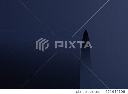 Midnight blue paper background with curved, matte surfaces and a smooth, grainy texture. Bold dark 121950106