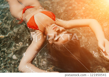 Happy woman sea relaxing floating in transparent sea water on summer holiday. Travel leisure recreation lifestyle, female in nature. 121950541