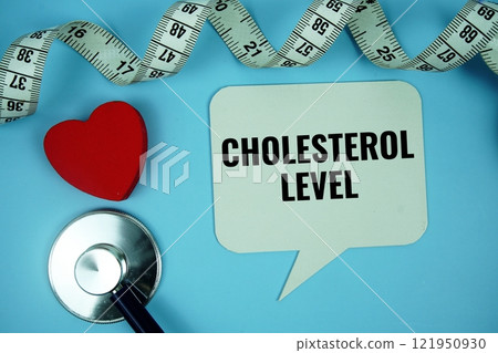 Cholesterol Level text message on speech bubble with Stethoscope  top view on blue background, Health concept background 121950930