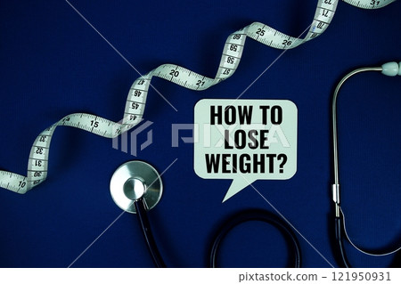 How To Lose Weight? text on speech bubble with measure tape and stethoscope on blue background, Healthy concept How To Lose Weight? text on speech bubble with measure tape and stethoscope on blue background, Healthy concept 121950931